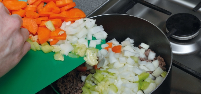 Adding vegetables to the pan
